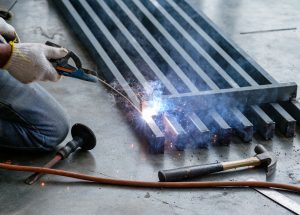 Industrial welder welding steel with sparks